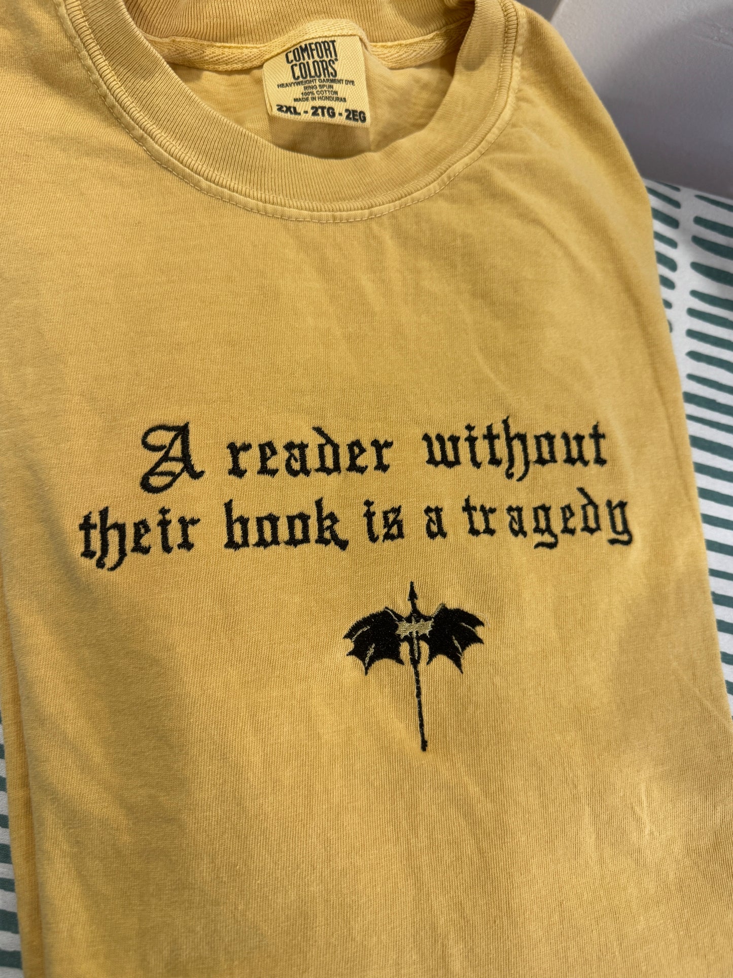 A Reader Without Their Book Is a Tragedy Tee