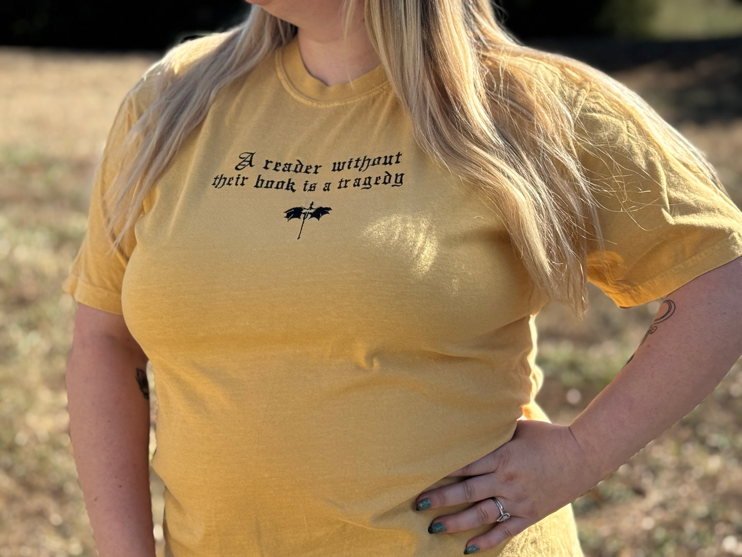 A Reader Without Their Book Is a Tragedy Tee