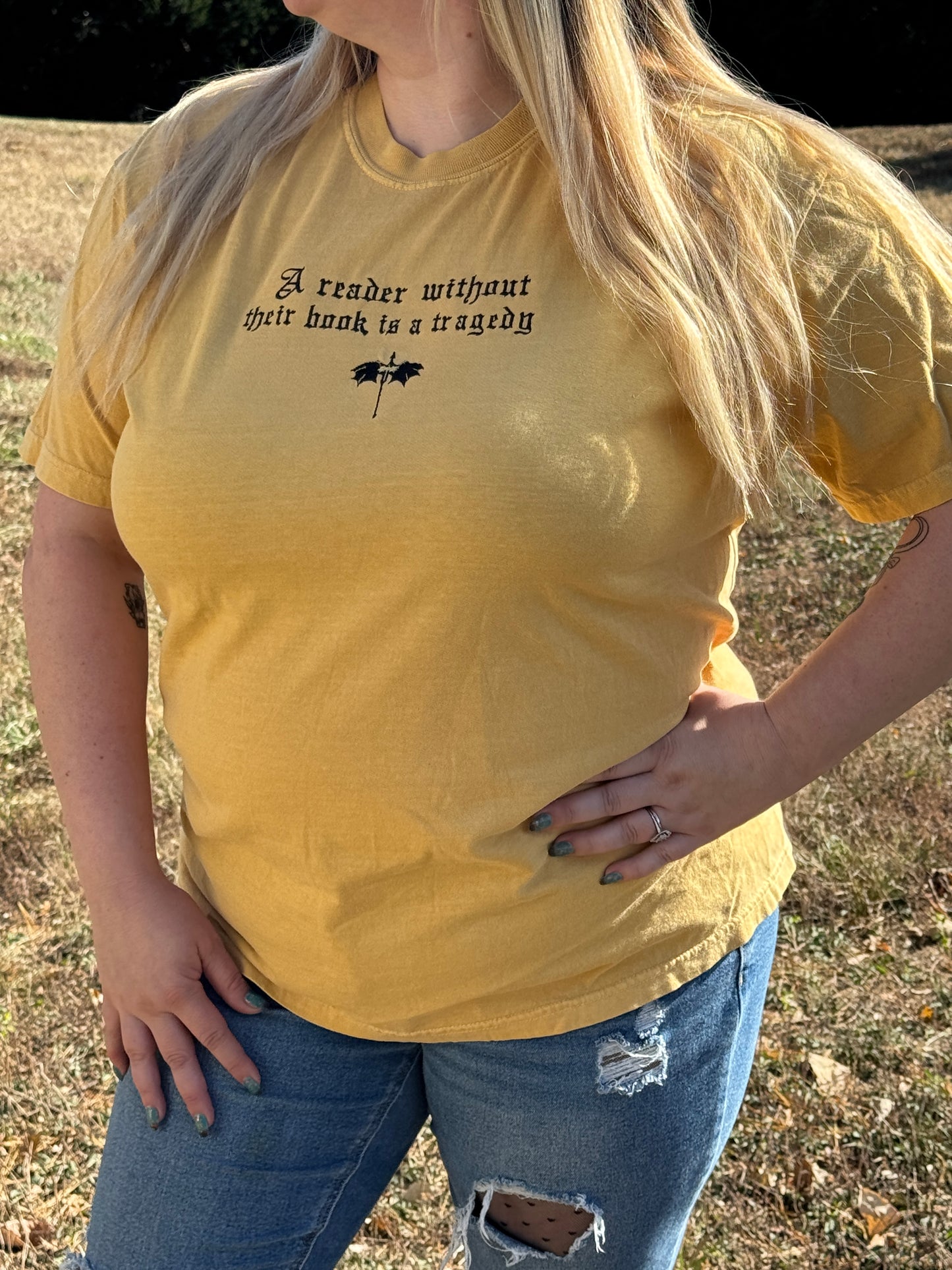 A Reader Without Their Book Is a Tragedy Tee