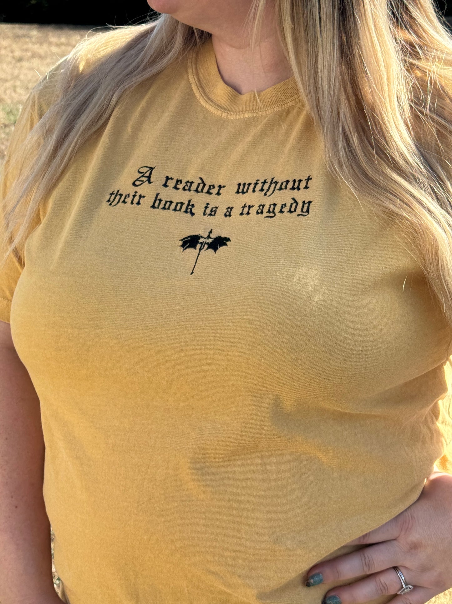 A Reader Without Their Book Is a Tragedy Tee