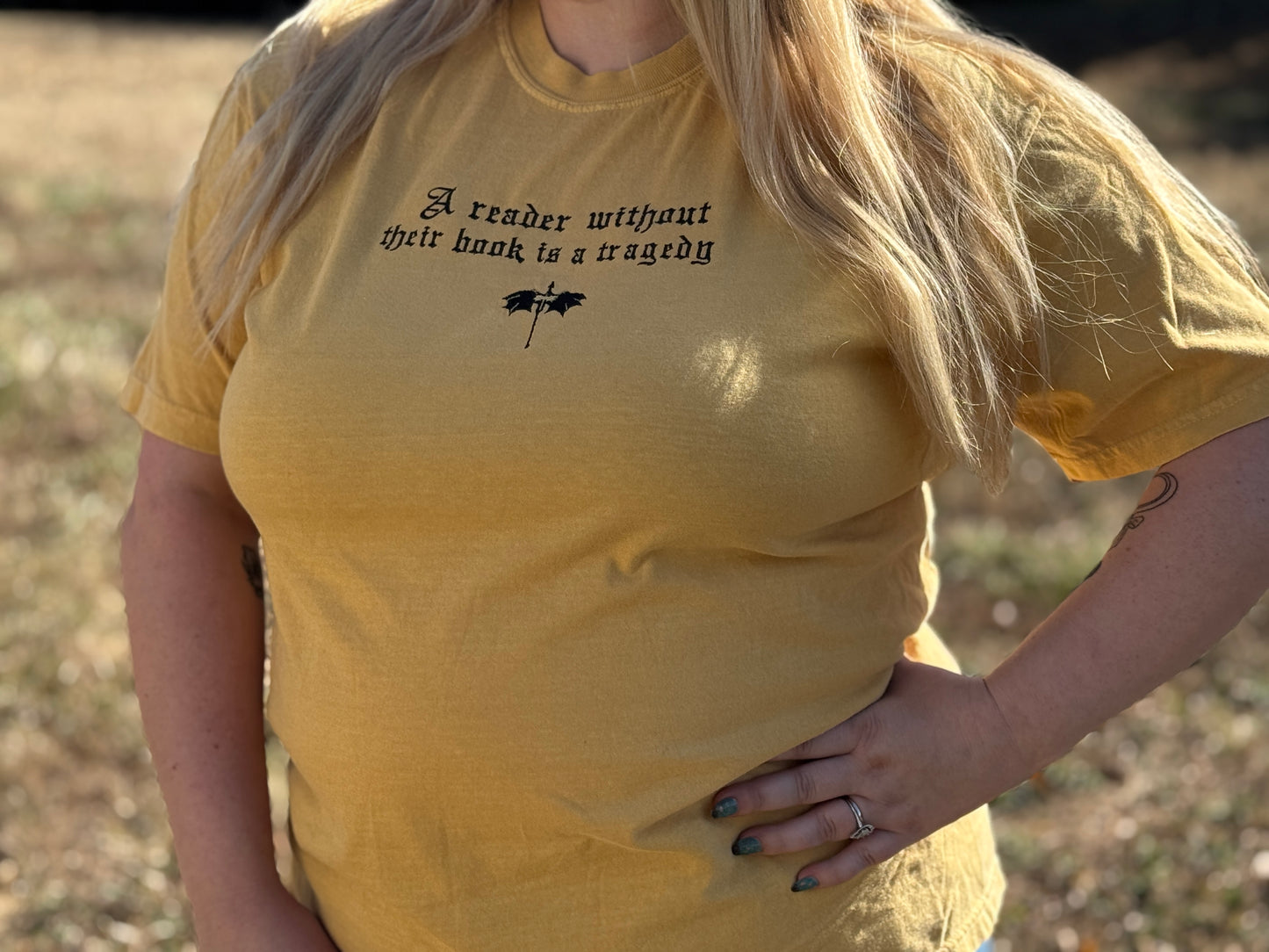 A Reader Without Their Book Is a Tragedy Tee